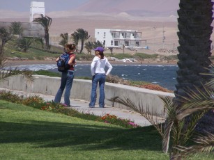 My wife and Jorges girlfriend.  Thats jorges place in the background right at the edge of the Natural Reserve.  And thats the bay in front that lights up everyday at noon and blows til dark!