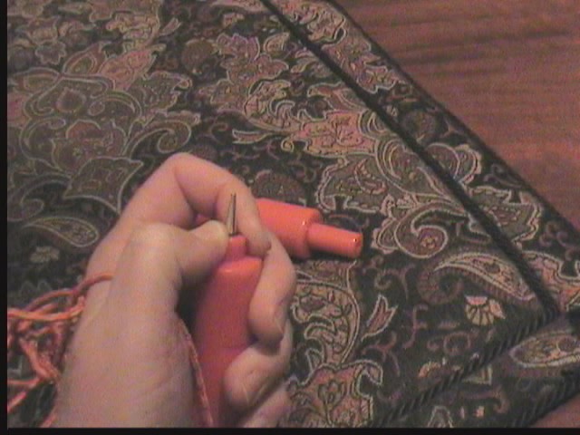 As pressure is applied, the outer covering retracts to reveal the picks.  Also a useful tool in case of bear attacks, or if KiteMe is in the area.