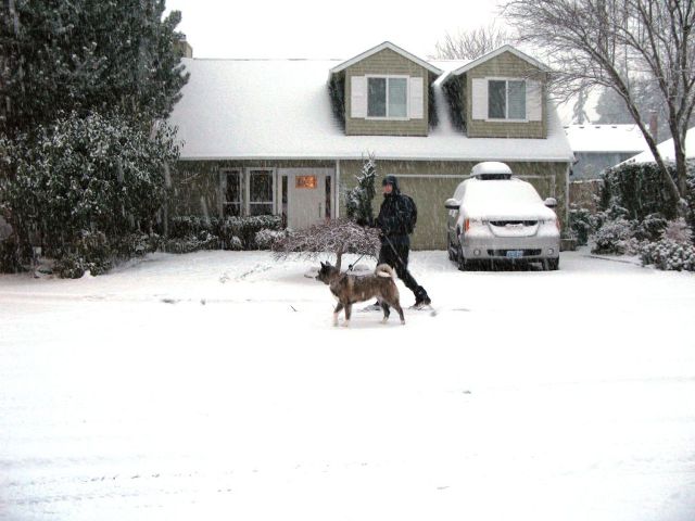 Onad and Kyla skiing in Beaverton in front of our house