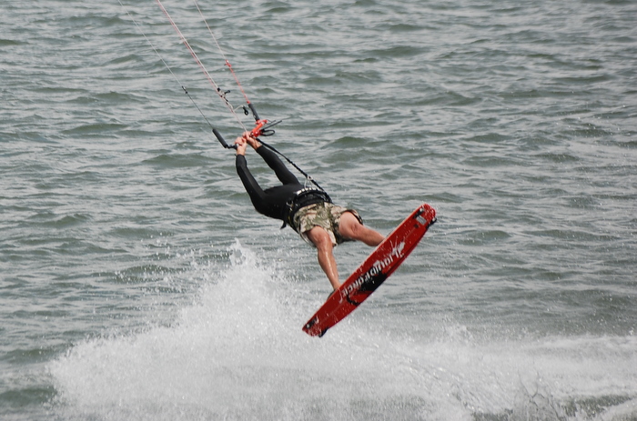 Beware the headless kiteboarder cleverly disguised as a mild mannered og on the beach.