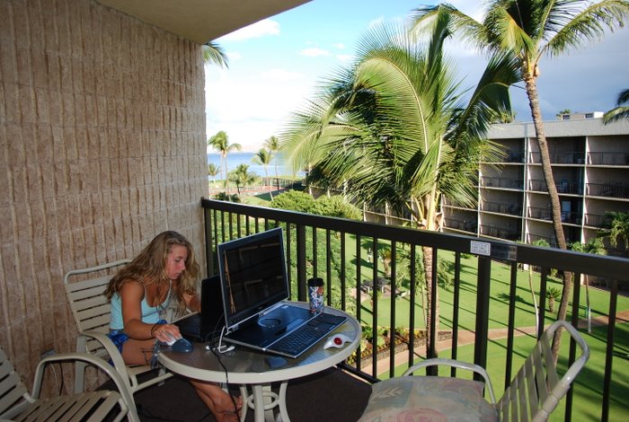 Becca doing internet school this morning. No wind in Kehei yet.