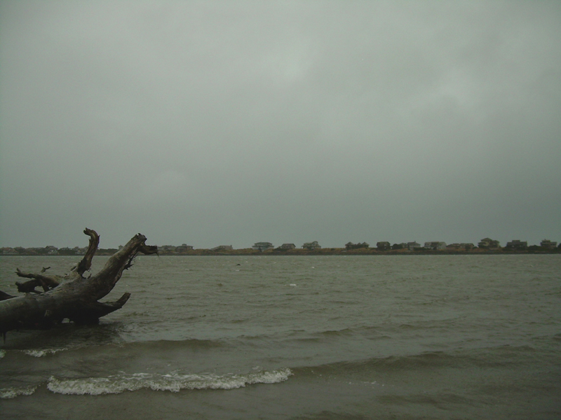brown water and gray skies seem to be the theme, blue water out in the channel