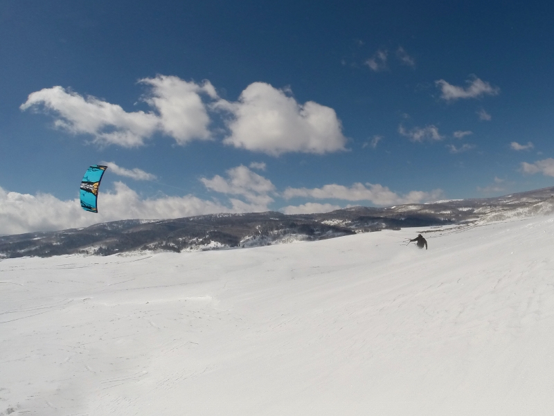 Victor combining championship ski skills and a kite