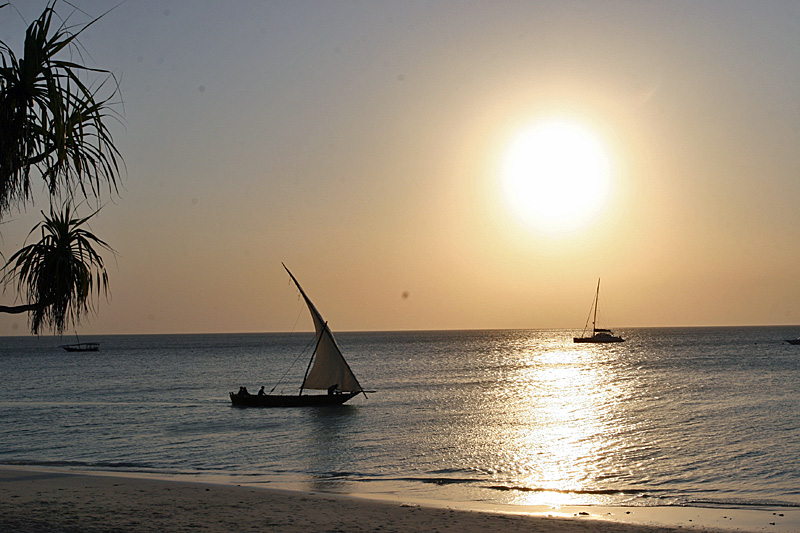 sunset with a dhow going by.