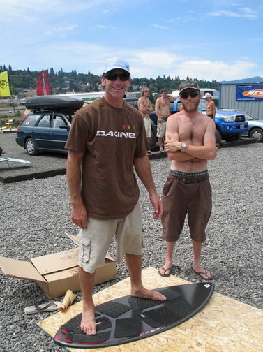 Dave and Willis with Cabal getting the skimboards ready for the day