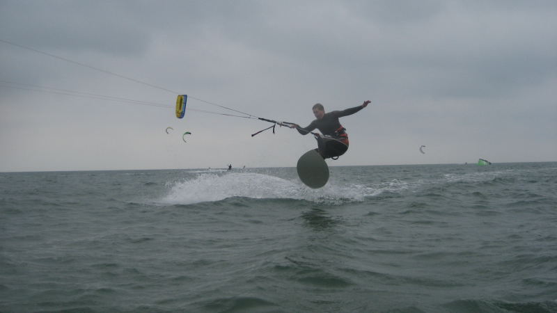 Ollie!  Skimboarding is still pretty new to this kite beach, I think a lot more people are going to start riding them now.