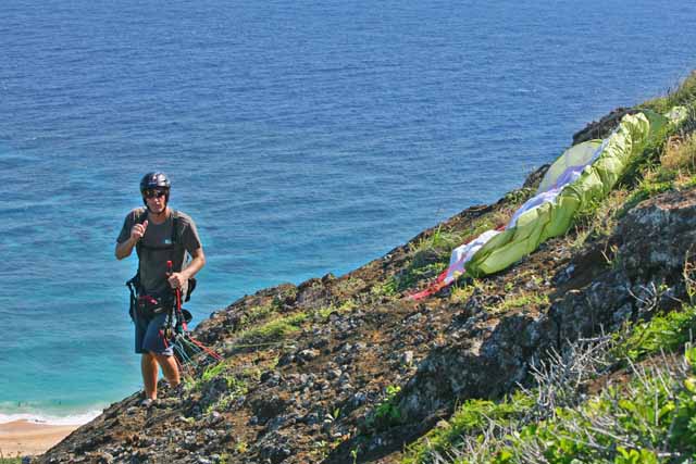 On launch at Koko Crater.  Super steep grabby rock, and about a 100ft drop about 4ft from his right foot.